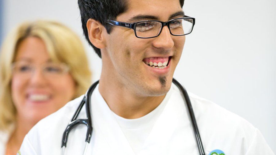 69 Nursing Student Smiling with Stethoscope Around His Neck